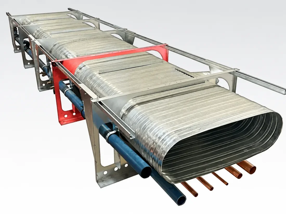 A completed multi-trade rack: oval duct, copper and PEX piping, ready to ship
